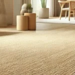 Modern living space featuring a large beige sisal carpet rug. Article title overlay discusses sisal for wet environments.